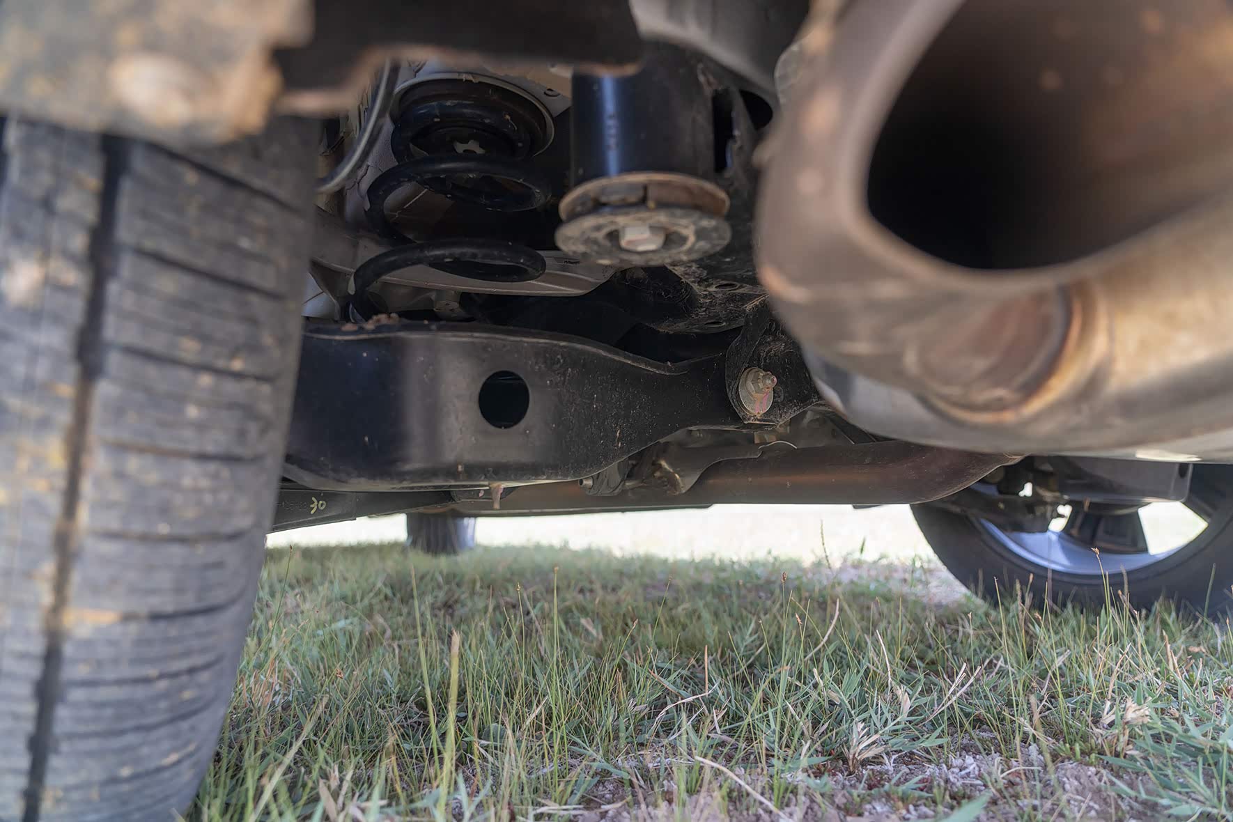 后悬由原来的三连杆换成四连杆